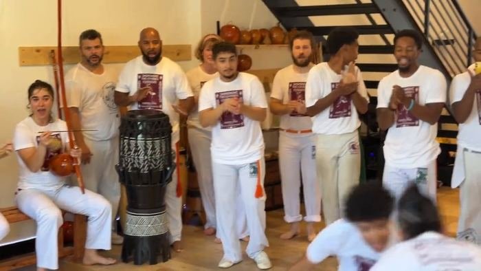 The roda at Capoeira Experience 2026, the full bateria playing